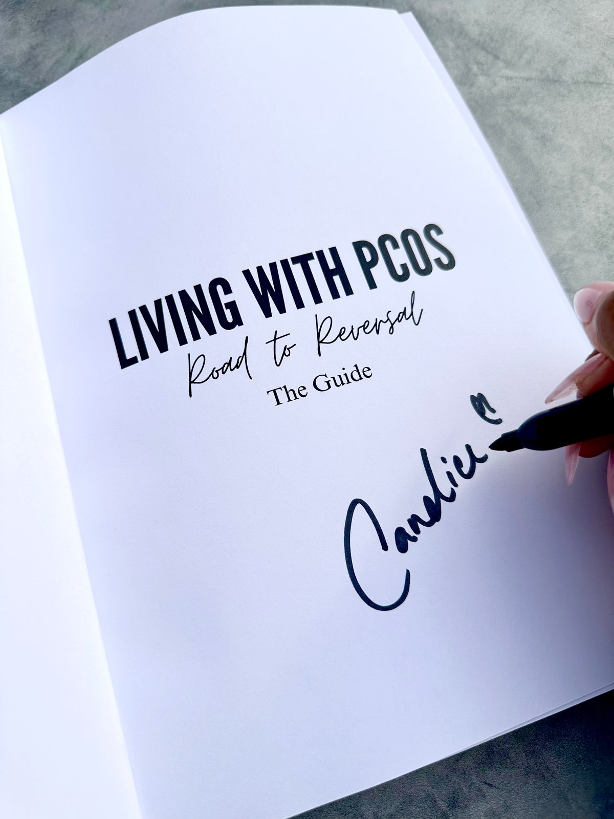 Hand written signature from Candice and Book Mark